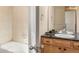 Well-maintained bathroom with vanity, bathtub, and neutral color palette at 2276 S Norse St, Lakewood, CO 80228