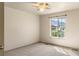 Neutral bedroom featuring a ceiling fan and large windows with mountain views at 2276 S Norse St, Lakewood, CO 80228