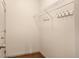 Bright walk-in closet featuring white wire shelving and ample space for organizing clothes and accessories at 2276 S Norse St, Lakewood, CO 80228