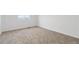 Empty carpeted bedroom with natural lighting at 7596 Grady Cir, Castle Rock, CO 80108