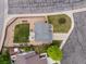 Aerial view of a home with a patio and well-maintained lawn surrounded by trees and neighborhood streets at 2006 E 97Th Ave, Thornton, CO 80229