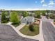 Aerial view of a well-maintained home with a spacious lot, mature trees, and neat landscaping at 2006 E 97Th Ave, Thornton, CO 80229