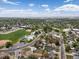 Neighborhood aerial showcases community park, pool, recreation areas, and nearby schools at 2006 E 97Th Ave, Thornton, CO 80229