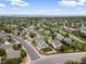 Overhead shot of homes surrounded by lush greenery in a quiet neighborhood with walking path at 2006 E 97Th Ave, Thornton, CO 80229