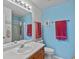 Bathroom with a single sink vanity, a large mirror, and a shower with glass door at 2006 E 97Th Ave, Thornton, CO 80229