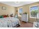 Sunny bedroom with two windows, neutral walls, and room for a bed and dresser at 2006 E 97Th Ave, Thornton, CO 80229