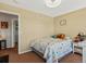 Bedroom with plush carpet, light walls, and a doorway to the home's hallway at 2006 E 97Th Ave, Thornton, CO 80229
