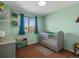 Charming Bedroom features a gray crib, colorful decor, and soothing paint, creating a cozy space at 2006 E 97Th Ave, Thornton, CO 80229