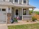 Charming front porch with decorative details, a welcoming entrance, and curb appeal at 2006 E 97Th Ave, Thornton, CO 80229