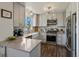 Well-lit kitchen featuring stainless steel appliances, light countertops, and ample cabinet space for storage at 2006 E 97Th Ave, Thornton, CO 80229