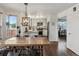Spacious kitchen and dining area with modern appliances, ample counter space, and stylish flooring at 2006 E 97Th Ave, Thornton, CO 80229