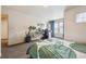 Bright bedroom featuring a dedicated office space and view from a large window at 9654 Martin Luther King Jr Blvd, Denver, CO 80238