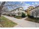 Street view showcasing the well-maintained landscaping and architecture of the townhome community at 9654 Martin Luther King Jr Blvd, Denver, CO 80238