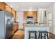 Bright kitchen features a large island, stainless steel refrigerator, and ample cabinet space at 9654 Martin Luther King Jr Blvd, Denver, CO 80238