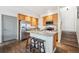 Kitchen featuring stainless steel appliances, granite countertops, a center island, and wooden cabinets at 9654 Martin Luther King Jr Blvd, Denver, CO 80238