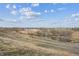 Scenic landscape with a winding path, calm waters, and natural vegetation at 9654 Martin Luther King Jr Blvd, Denver, CO 80238