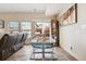 Living room featuring a modern dining set, sleek couch, and scenic outdoor views at 9654 Martin Luther King Jr Blvd, Denver, CO 80238