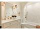 Elegant bathroom features a marble countertop, modern fixtures, and a stylish soaking tub at 24 Spyglass Dr, Littleton, CO 80123