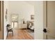 Bright bedroom featuring hardwood floors, a glass door, and accent decor at 24 Spyglass Dr, Littleton, CO 80123