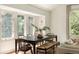 Inviting dining area features ample natural light and a stylish table perfect for gatherings at 24 Spyglass Dr, Littleton, CO 80123