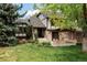 Beautiful home with lush landscaped front yard, well-manicured lawn, and inviting curb appeal at 24 Spyglass Dr, Littleton, CO 80123