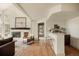 Living room with fireplace, hardwood floors and bar with sink and stools at 24 Spyglass Dr, Littleton, CO 80123
