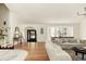 Open-concept living area with modern furnishings, hardwood floors, and bright, airy ambiance at 24 Spyglass Dr, Littleton, CO 80123