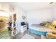Cozy bedroom featuring wood floors, a comfortable bed, and charming decor at 919 S Dawson Way # 17, Aurora, CO 80012