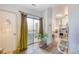 Inviting entryway with hardwood floors and sliding glass door leading to outdoor space at 919 S Dawson Way # 17, Aurora, CO 80012