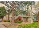 Two-story townhouse features a private balcony with brick accents and well-maintained landscaping at 919 S Dawson Way # 17, Aurora, CO 80012