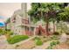 Well-maintained exterior of a multi-story building with balconies, brick accents, and landscaped grounds at 919 S Dawson Way # 17, Aurora, CO 80012