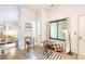 Bright living area featuring wood floors, a cozy seating area, and natural light from windows at 919 S Dawson Way # 17, Aurora, CO 80012