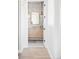 Hallway view of bathroom with double vanity and hanging mirrors at 1968 S Washington St, Denver, CO 80210