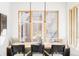 Stylish dining room featuring a large window and seating at 1968 S Washington St, Denver, CO 80210