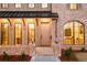 Charming brick home featuring a welcoming front entrance and a unique arched window accent at 1968 S Washington St, Denver, CO 80210