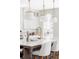 Bright kitchen island with marble countertops, brass fixtures, and stylish pendant lighting at 1968 S Washington St, Denver, CO 80210
