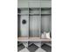 Functional mudroom with built-in cubbies, bench seating, and stylish black and white tile floors at 1968 S Washington St, Denver, CO 80210