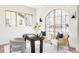 Bright home office with natural light, arched window, and comfortable seating area at 1968 S Washington St, Denver, CO 80210