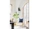 Cozy office features a large arched window and white brick accent walls at 1968 S Washington St, Denver, CO 80210