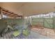 Relaxing back patio with outdoor seating, a wooden fence, and a covered patio area at 2465 W Caithness Pl, Denver, CO 80211