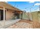 Relaxing back patio features outdoor seating, a wooden fence, and string lights overhead at 2465 W Caithness Pl, Denver, CO 80211