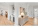A stylish bar area featuring beverage coolers, cabinetry, and an elegant design at 4452 Xavier St, Denver, CO 80212