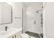 Modern bathroom featuring a glass-enclosed shower, sleek vanity, and contemporary fixtures at 4452 Xavier St, Denver, CO 80212