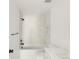 Modern bathroom features a shower/tub combo with white tile, matte black fixtures, and sleek vanity at 4452 Xavier St, Denver, CO 80212