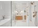 Elegant bathroom with double shower, soaking tub, and vanity with gold fixtures at 4452 Xavier St, Denver, CO 80212