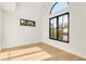 Minimalist bedroom featuring an abundance of natural light from black frame windows at 4452 Xavier St, Denver, CO 80212