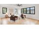 Spacious bedroom with hardwood floors, multiple windows, and modern decor at 4452 Xavier St, Denver, CO 80212