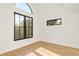 Bright bedroom with large windows and light hardwood floors, providing ample natural light at 4452 Xavier St, Denver, CO 80212