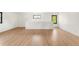 Bright bonus room featuring hardwood floors, natural light from black trimmed windows at 4452 Xavier St, Denver, CO 80212