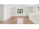 Bright bonus room featuring hardwood floors, natural light from black trimmed windows at 4452 Xavier St, Denver, CO 80212